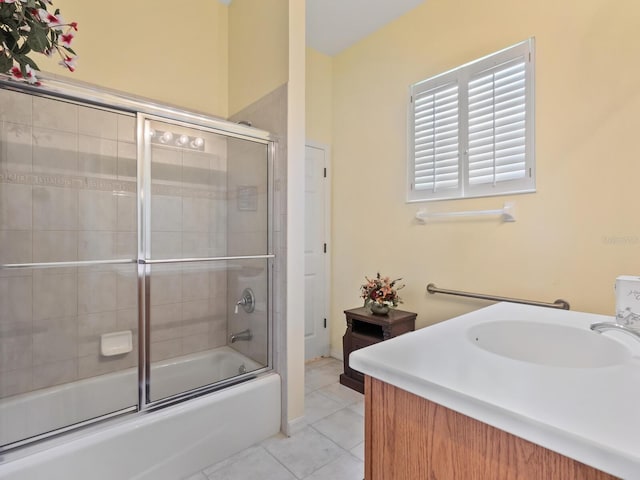 280 Dahlia Ct, Bradenton, FL 34212 - bathroom with tile patterned flooring, bath / shower combo with glass door, and vanity