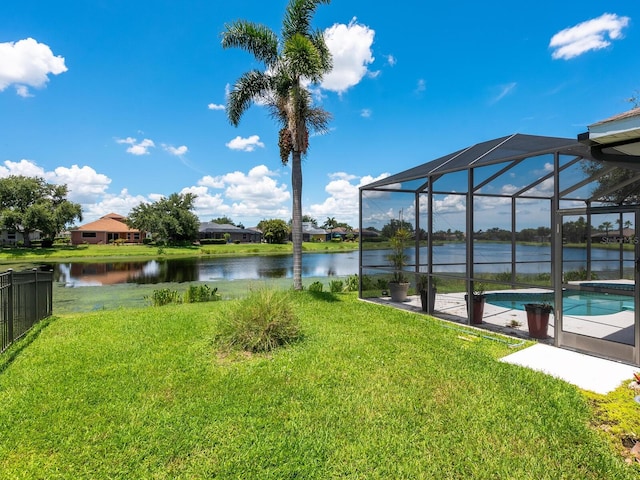 280 Dahlia Ct, Bradenton, FL 34212 - view of grassy yard with an outdoor pool, a water view, and a lanai