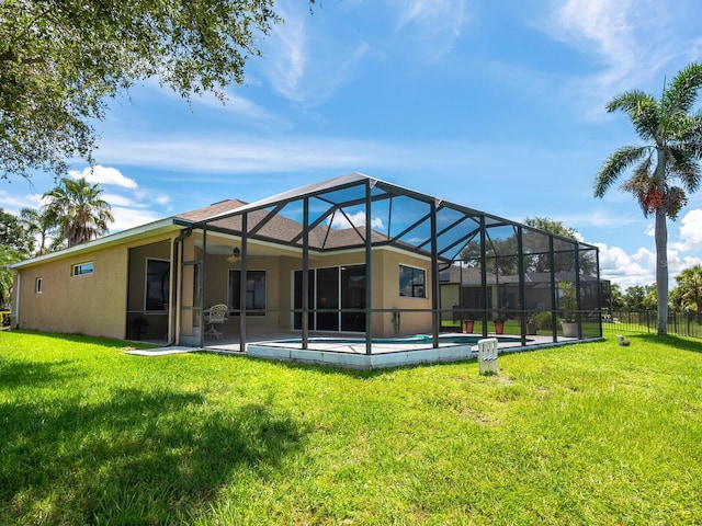 280 Dahlia Ct, Bradenton, FL 34212 - rear view of property featuring stucco siding, a patio area, and glass enclosure