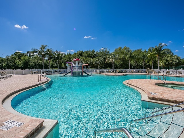 280 Dahlia Ct, Bradenton, FL 34212 - community pool with a community hot tub, a patio area, and view of wooded area