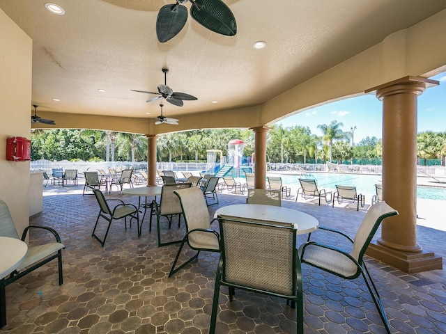 280 Dahlia Ct, Bradenton, FL 34212 - view of patio / terrace featuring a ceiling fan and a community pool