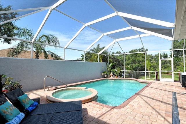 730 137th St NE, Bradenton, FL 34212 - view of swimming pool featuring a patio, a pool with connected hot tub, and glass enclosure