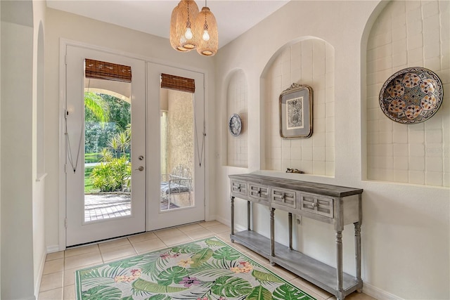 730 137th St NE, Bradenton, FL 34212 - entryway featuring french doors, a chandelier, and light tile patterned floors