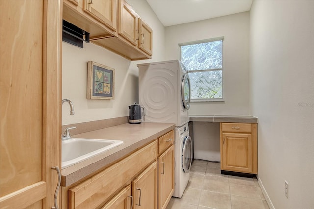 730 137th St NE, Bradenton, FL 34212 - laundry room with stacked washer / drying machine, cabinet space, and light tile patterned floors
