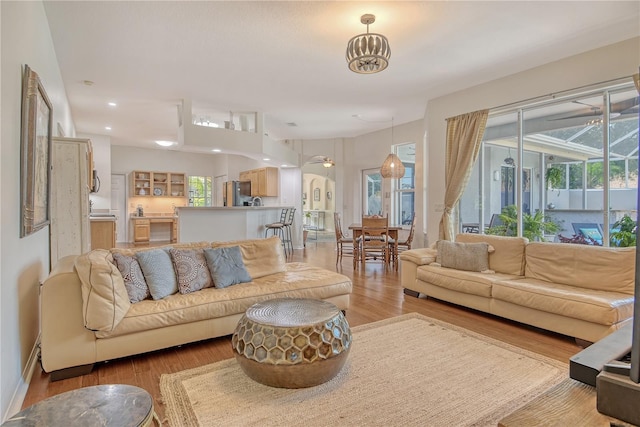 730 137th St NE, Bradenton, FL 34212 - living area with light wood-style floors, recessed lighting, and arched walkways