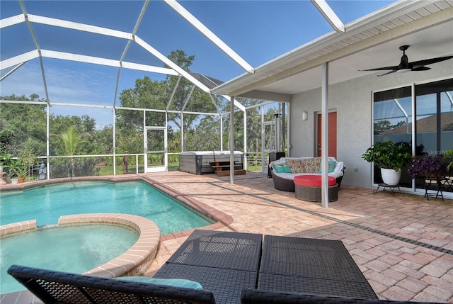 730 137th St NE, Bradenton, FL 34212 - view of pool with a patio, glass enclosure, a pool with connected hot tub, outdoor lounge area, and a ceiling fan