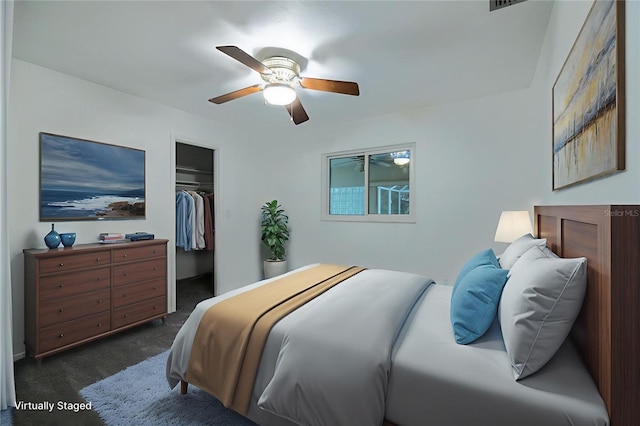 1208 Francis Ave, Sarasota, FL 34232 - bedroom with dark carpet, a ceiling fan, and a closet