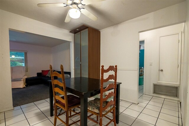 1208 Francis Ave, Sarasota, FL 34232 - dining room featuring light tile patterned flooring, a ceiling fan, and light carpet