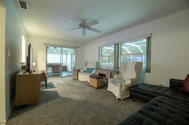 1208 Francis Ave, Sarasota, FL 34232 - living area featuring a ceiling fan, carpet floors, and healthy amount of natural light