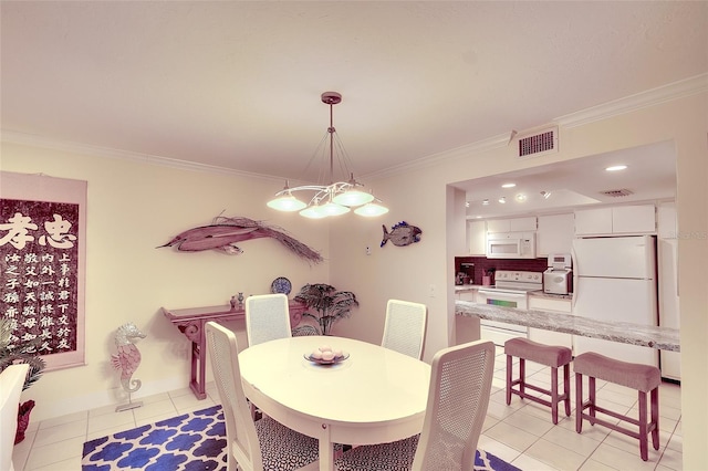 2039 Gulf Of Mexico Dr Unit G3-207, Longboat Key, FL 34228 - dining room with light tile patterned flooring and ornamental molding