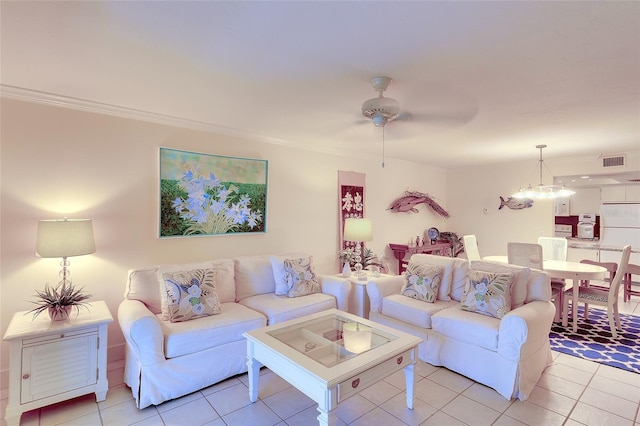 2039 Gulf Of Mexico Dr Unit G3-207, Longboat Key, FL 34228 - living room with light tile patterned floors, ornamental molding, and ceiling fan