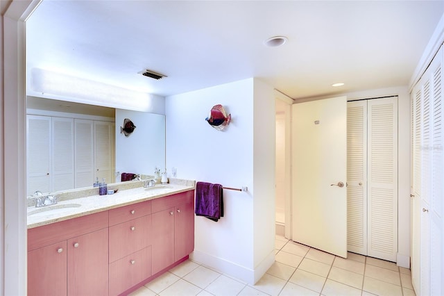 2039 Gulf Of Mexico Dr Unit G3-207, Longboat Key, FL 34228 - full bathroom with a closet, double vanity, and tile patterned floors