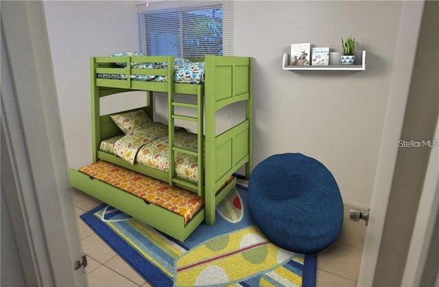 2763 Woodgate Ln Unit 105, Sarasota, FL 34231 - bedroom with tile patterned floors