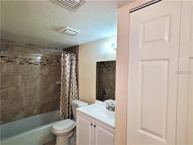 2763 Woodgate Ln Unit 105, Sarasota, FL 34231 - full bathroom featuring vanity, shower / bath combination with curtain, and a textured ceiling