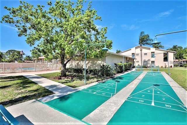 2763 Woodgate Ln Unit 105, Sarasota, FL 34231 - view of community featuring shuffleboard