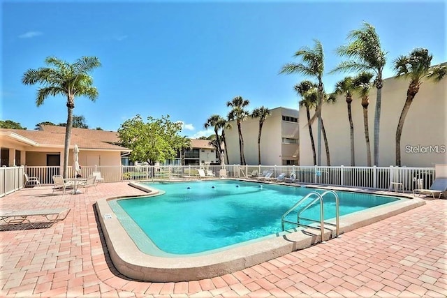 2763 Woodgate Ln Unit 105, Sarasota, FL 34231 - community pool featuring a patio