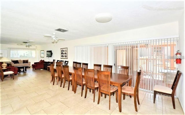 2763 Woodgate Ln Unit 105, Sarasota, FL 34231 - dining room featuring a ceiling fan