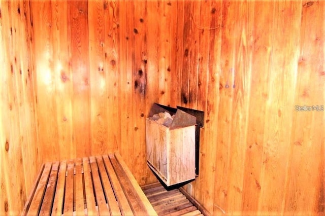 2763 Woodgate Ln Unit 105, Sarasota, FL 34231 - sauna with wood walls and wood finished floors