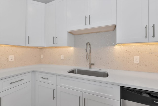 4515 19th Ave W, Bradenton, FL 34209 - kitchen featuring white cabinetry, dishwashing machine, light countertops, and backsplash