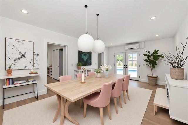 4515 19th Ave W, Bradenton, FL 34209 - dining space featuring french doors, light wood finished floors, recessed lighting, and an AC wall unit