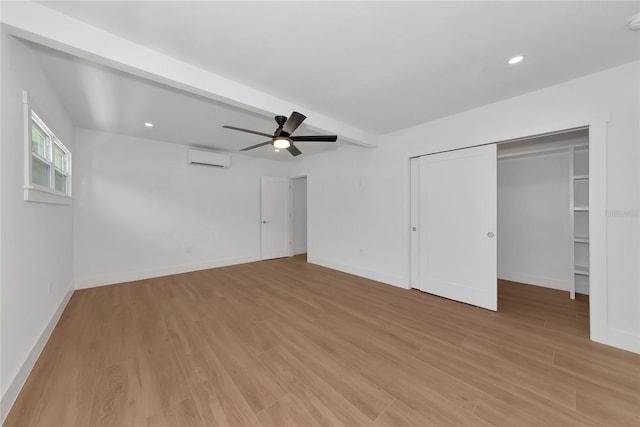 4515 19th Ave W, Bradenton, FL 34209 - unfurnished bedroom with light wood-style flooring, recessed lighting, a ceiling fan, a wall mounted AC, and beam ceiling