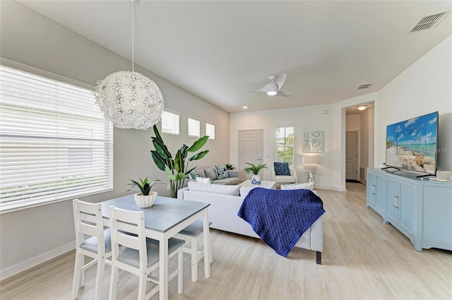 11431 Piedmont Park Xing, Bradenton, FL 34211 - living room featuring light wood-style floors, a chandelier, and a ceiling fan
