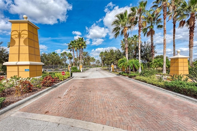 11431 Piedmont Park Xing, Bradenton, FL 34211 - view of decorative road featuring a gate, curbs, and a gated entry