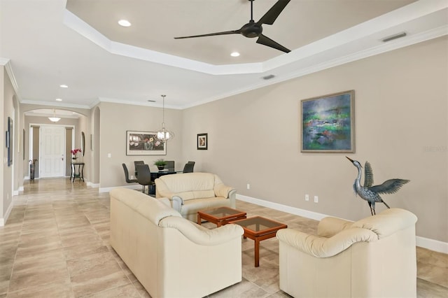 5596 Cantucci St, Nokomis, FL 34275 - living area featuring arched walkways, recessed lighting, a raised ceiling, ceiling fan, and ornamental molding