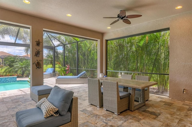 5596 Cantucci St, Nokomis, FL 34275 - view of patio with ceiling fan, an outdoor pool, glass enclosure, and outdoor dining area