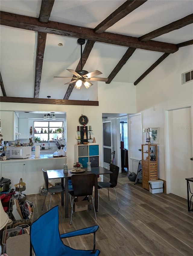 5231 Brassy Loop, North Port, FL 34287 - dining area featuring plenty of natural light, ceiling fan, wood finished floors, high vaulted ceiling, and beamed ceiling