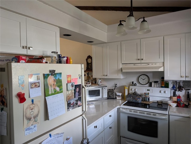 5231 Brassy Loop, North Port, FL 34287 - kitchen featuring white appliances, under cabinet range hood, light countertops, and white cabinets