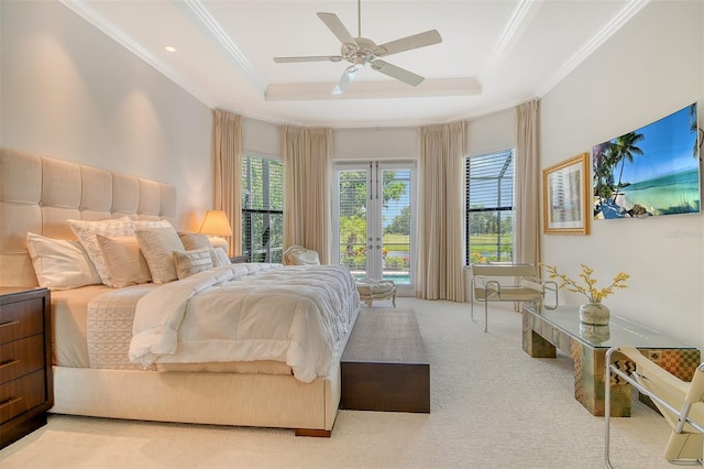 7638 Windy Hill Cv, Bradenton, FL 34202 - bedroom with a raised ceiling, crown molding, carpet, french doors, and a ceiling fan