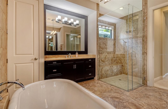 7638 Windy Hill Cv, Bradenton, FL 34202 - full bathroom featuring a freestanding tub, vanity, a shower stall, and a chandelier