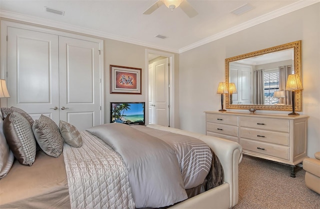7638 Windy Hill Cv, Bradenton, FL 34202 - carpeted bedroom with a closet, ornamental molding, and a ceiling fan