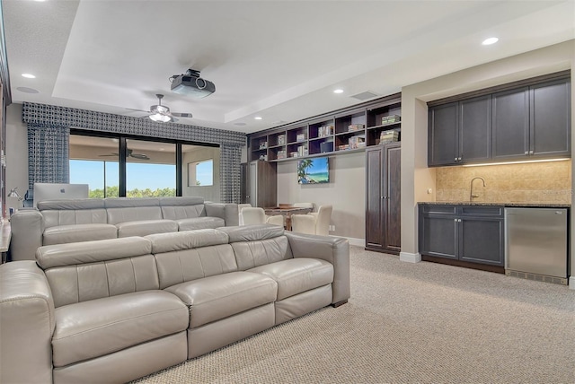 7638 Windy Hill Cv, Bradenton, FL 34202 - cinema featuring wet bar, recessed lighting, light colored carpet, a raised ceiling, and a ceiling fan