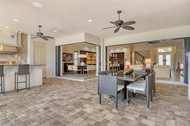 7638 Windy Hill Cv, Bradenton, FL 34202 - dining area featuring stairway, ceiling fan, brick flooring, and recessed lighting