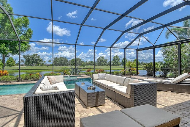7638 Windy Hill Cv, Bradenton, FL 34202 - view of patio featuring an outdoor living space, an in-ground hot tub, a water view, and an outdoor pool