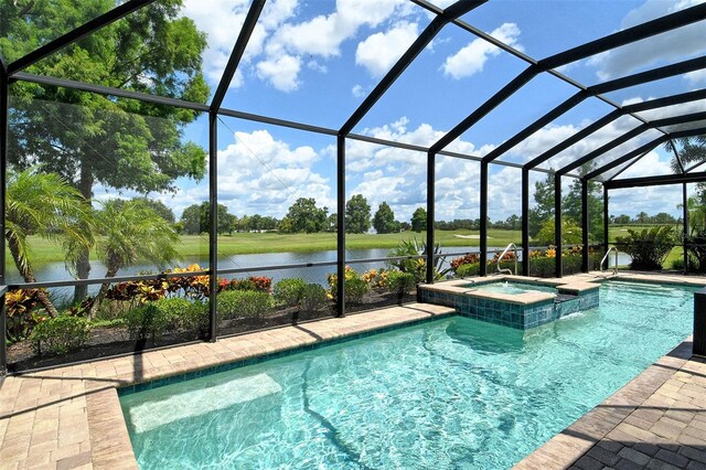 7638 Windy Hill Cv, Bradenton, FL 34202 - view of swimming pool with a water view, a pool with connected hot tub, glass enclosure, and a patio area