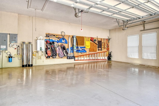 7638 Windy Hill Cv, Bradenton, FL 34202 - garage with electric panel, a garage door opener, and water heater