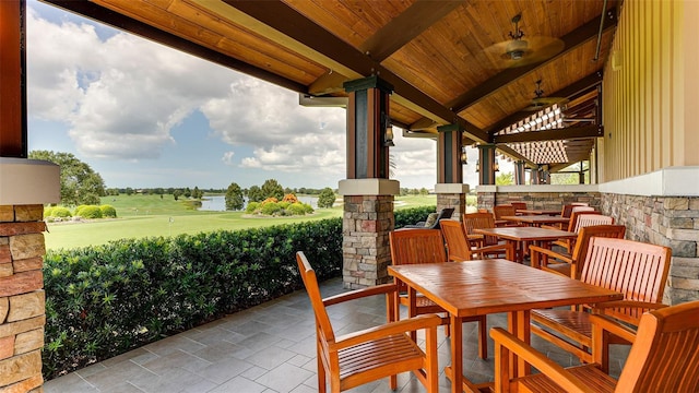 7638 Windy Hill Cv, Bradenton, FL 34202 - view of patio / terrace with a water view, golf course view, and exterior bar