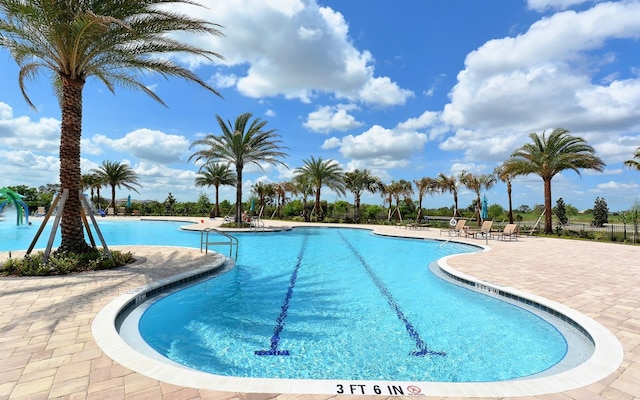 7638 Windy Hill Cv, Bradenton, FL 34202 - community pool featuring a patio area