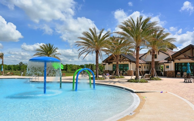 7638 Windy Hill Cv, Bradenton, FL 34202 - community pool with a water play area and a patio area