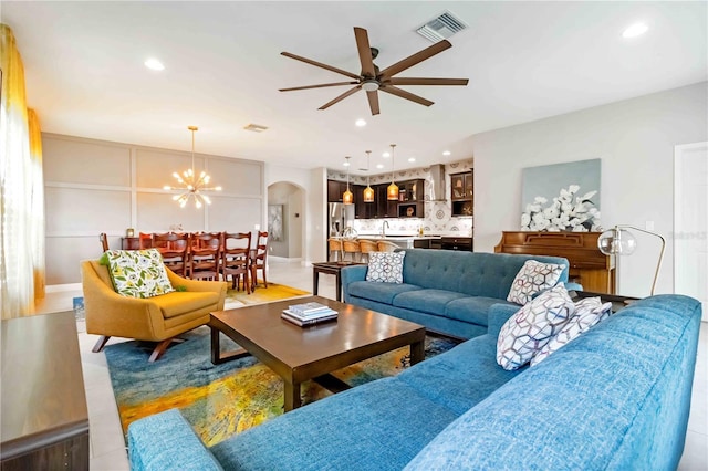 4044 Wisdom Trl, Land O Lakes, FL 34638 - living area with arched walkways, ceiling fan, recessed lighting, and a chandelier
