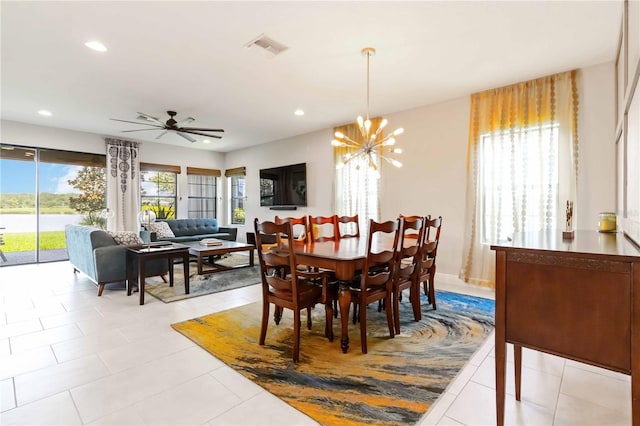 4044 Wisdom Trl, Land O Lakes, FL 34638 - dining room featuring a chandelier, recessed lighting, a ceiling fan, a water view, and light tile patterned flooring