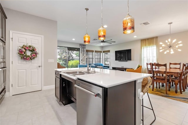 4044 Wisdom Trl, Land O Lakes, FL 34638 - kitchen with dishwasher, a chandelier, light countertops, hanging light fixtures, and light tile patterned flooring