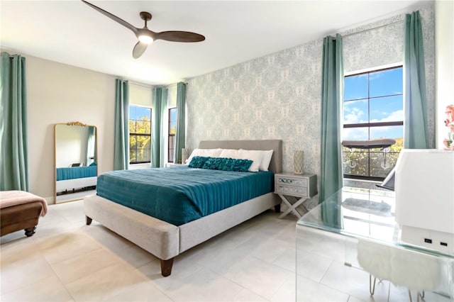 4044 Wisdom Trl, Land O Lakes, FL 34638 - tiled bedroom with multiple windows, wallpapered walls, ceiling fan, and access to exterior