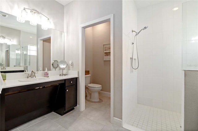 4044 Wisdom Trl, Land O Lakes, FL 34638 - bathroom with a tile shower, vanity, and tile patterned floors