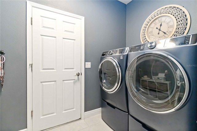 4044 Wisdom Trl, Land O Lakes, FL 34638 - laundry area with washing machine and dryer and light tile patterned floors