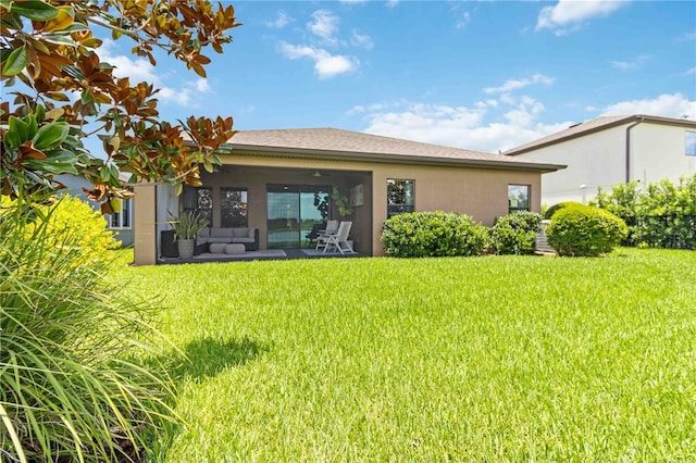 4044 Wisdom Trl, Land O Lakes, FL 34638 - rear view of property with a yard, an outdoor living space, and stucco siding
