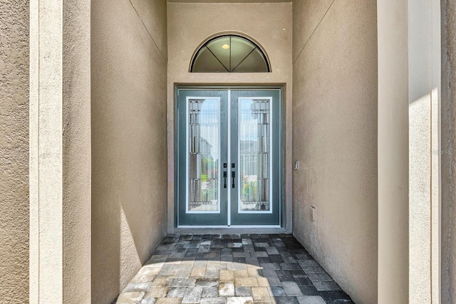 9215 Isabella Cir, Parrish, FL 34219 - entrance to property featuring french doors and stucco siding